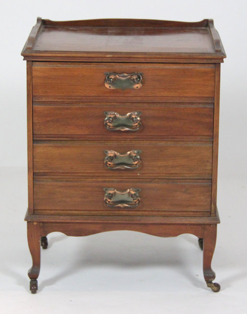 An Edwardian walnut sheet music