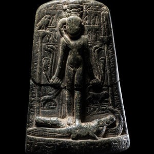 An Egyptian Black Stone Cippus of