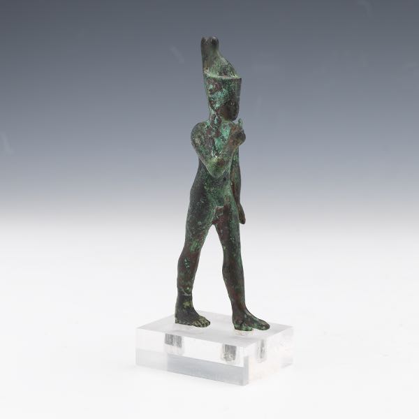 AN EGYPTIAN BRONZE FIGURE OF