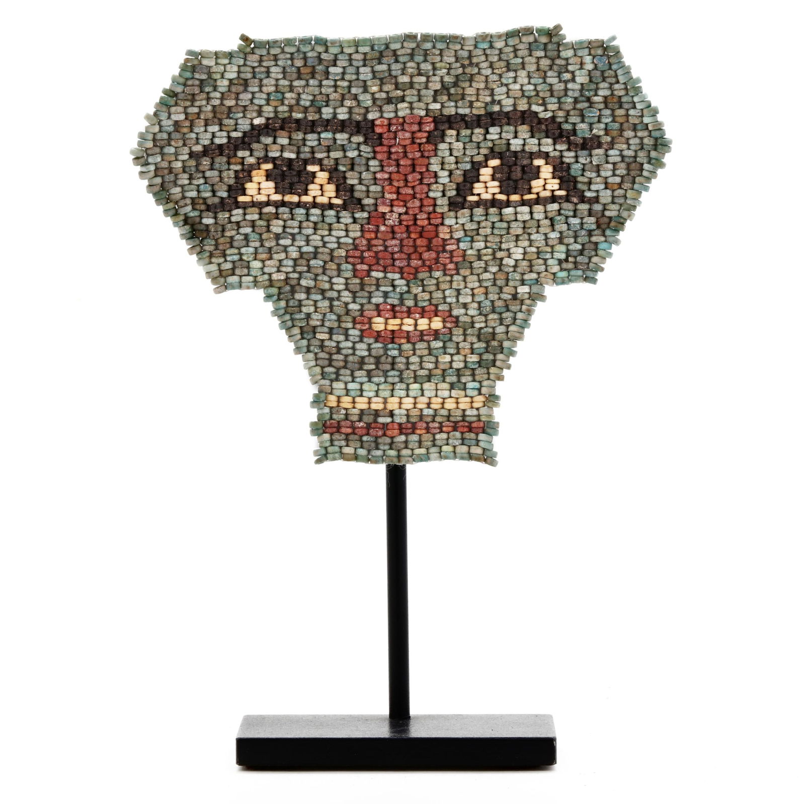 AN EGYPTIAN FAIENCE MUMMY MASKAn