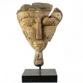 AN EGYPTIAN WOOD MASK WITH A G