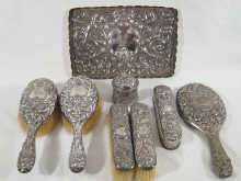 An eight piece silver dressing