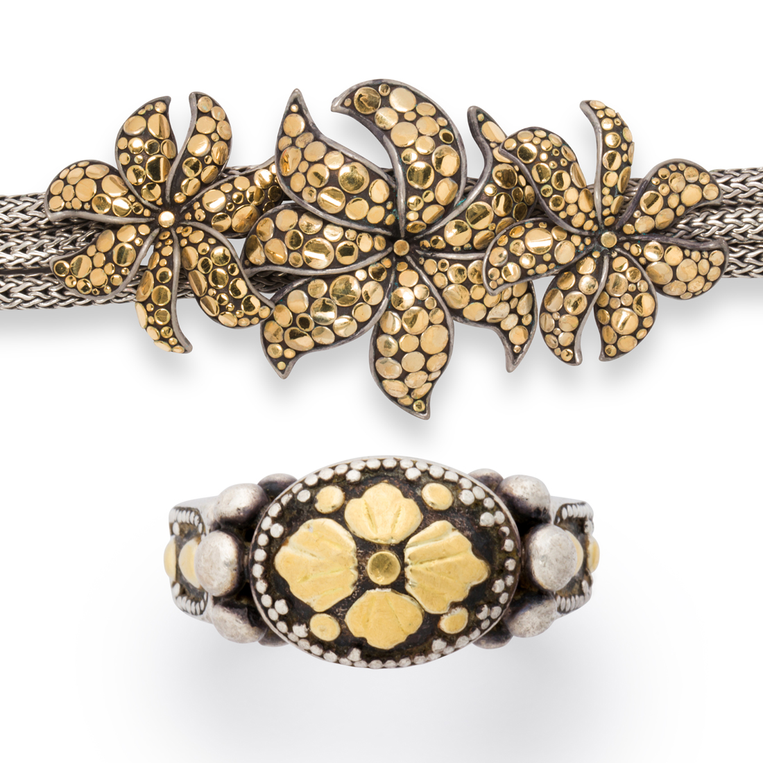 AN EIGHTEEN KARAT GOLD AND STERLING