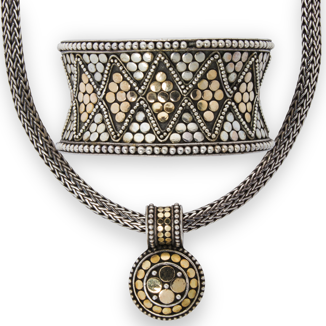 AN EIGHTEEN KARAT GOLD AND STERLING