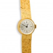 AN EIGHTEEN KARAT GOLD WRITSTW