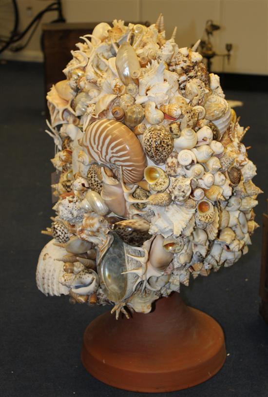An elaborate shell work model torso