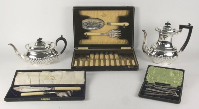 An electroplated silver teapot