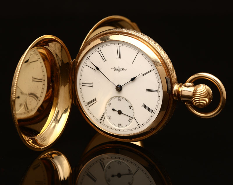 An Elgin 18K gold pocket watch