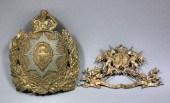 An embossed gilt brass helmet