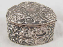 An embossed silver heart shaped