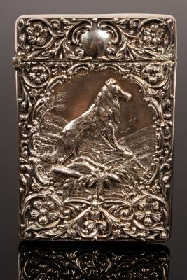 An embossed silver visiting card