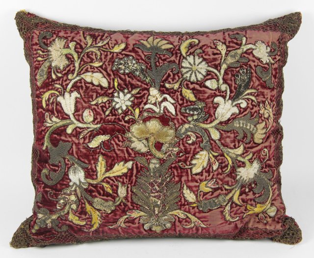 An embroidered cushion covered with
