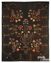 AN EMBROIDERED WOOL BEDSPREAD,