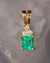 AN EMERALD AND DIAMOND PENDANT