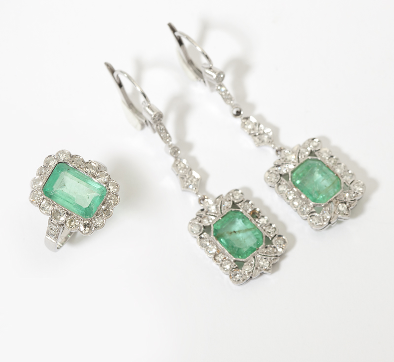 An emerald and diamond ring and a