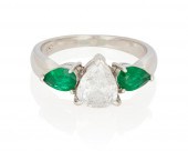 AN EMERALD AND DIAMOND RINGAn