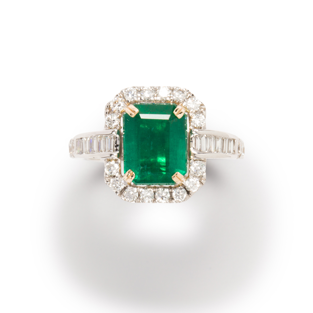 AN EMERALD, DIAMOND AND FOURTEEN