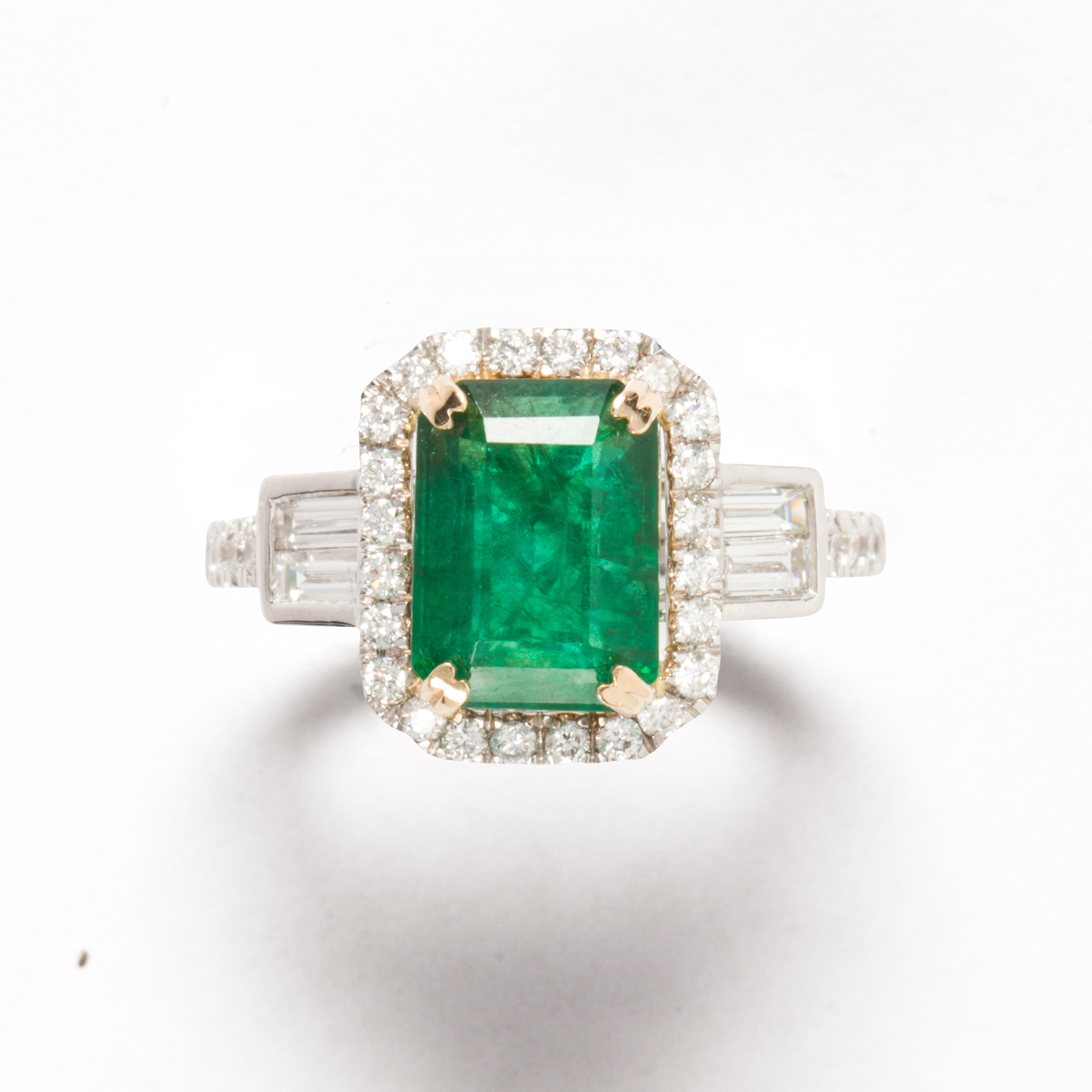 AN EMERALD, DIAMOND AND FOURTEEN