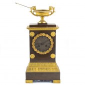 AN EMPIRE GILT AND PATINATED B