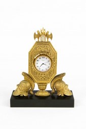 AN EMPIRE GILT AND PATINATED B