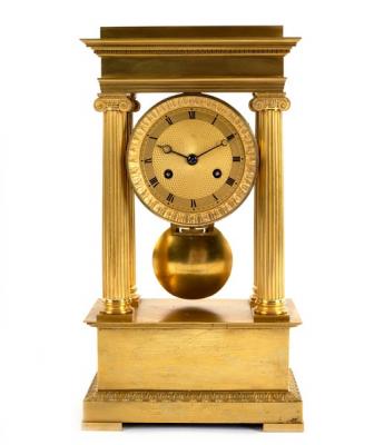 An Empire ormolu portico clock with