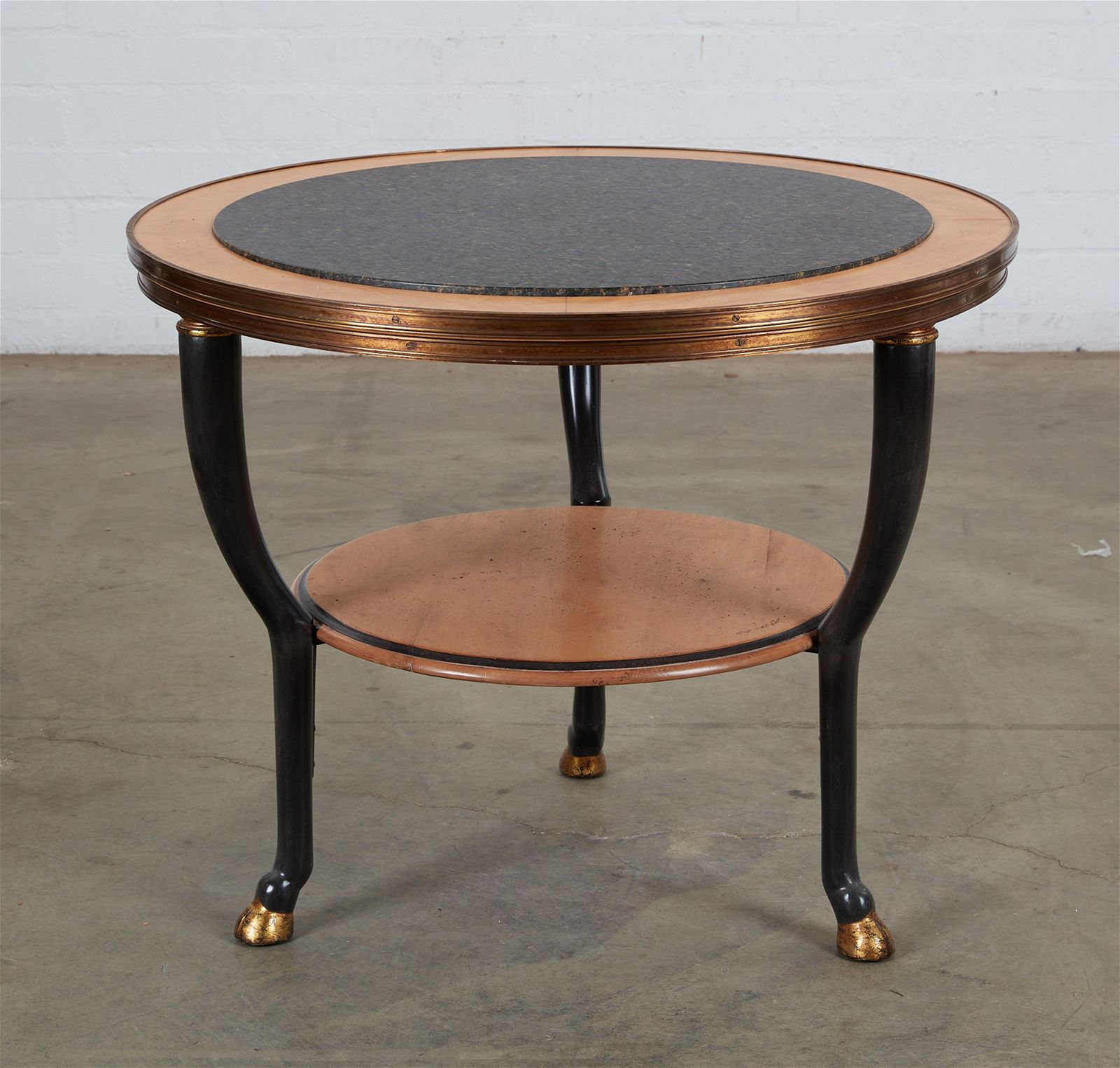 AN EMPIRE STYLE GILT CIRCULAR