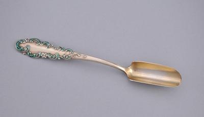 An Enameled Sterling Cheese Scoop