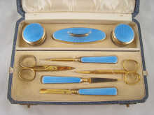 An engine turned silver gilt blue