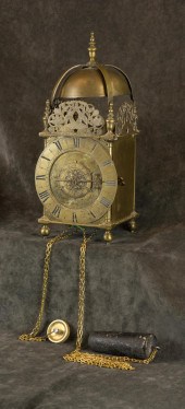 AN ENGLISH BRASS STRIKING LANT