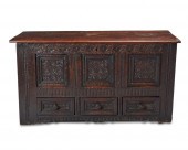 AN ENGLISH CARVED OAK BRIDAL C