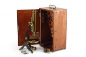 AN ENGLISH LACQUERED BRASS MON