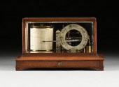 AN ENGLISH OAK AND GLASS CASED