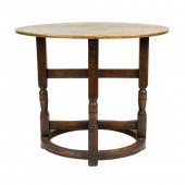 AN ENGLISH OAK TABLE IN THE JA
