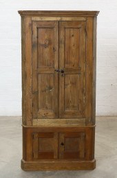 AN ENGLISH PINE CORNER CUPBOAR