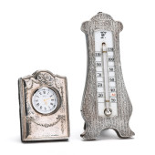 AN ENGLISH SILVER CLOCK AND ST