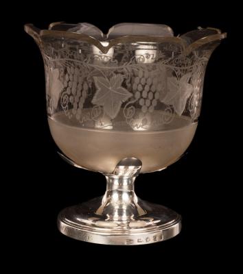 An engraved glass vase with a