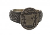 An Engraved Iron Ring Depictin