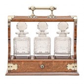 An EPNS mounted oak tantalus,