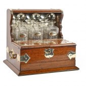 An EPNS mounted oak tantalus,