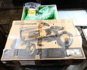 AN ERTL JOHN DEERE PEDAL CYCLE
