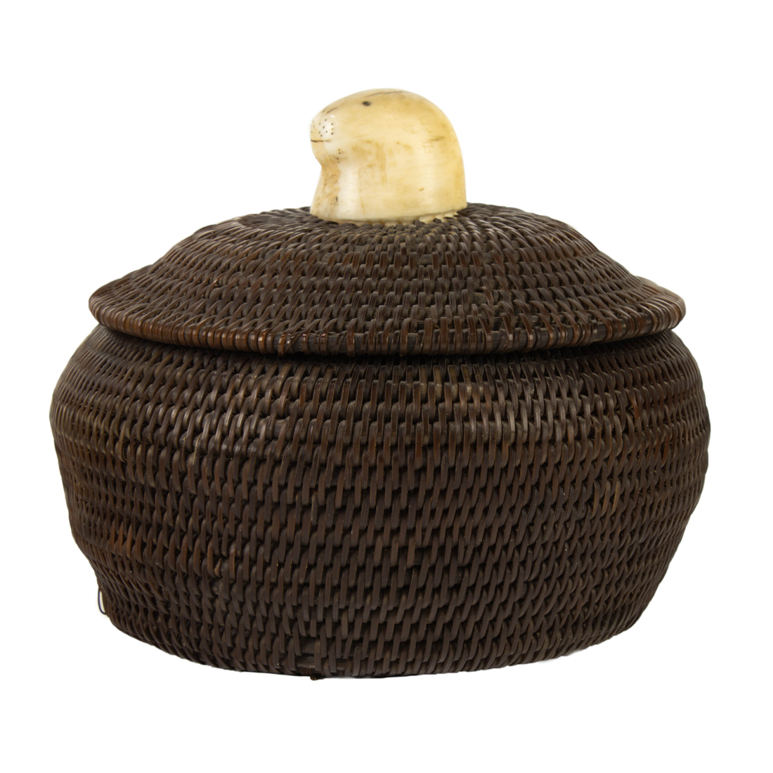 AN ESKIMO BALEEN BASKET WITH A SEAL