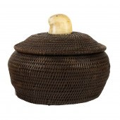 AN ESKIMO BALEEN BASKET WITH A