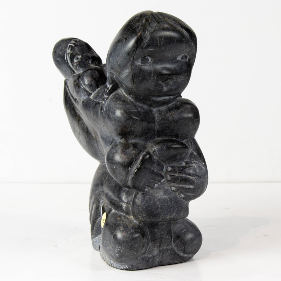 AN ESKIMO SCULPTURE OF MOTHER AND