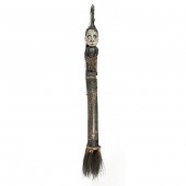 AN ETHNIC FIGURAL STAFF CARVED