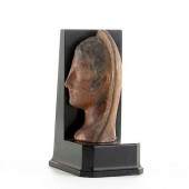 AN ETRUSCAN PAINTED TERRACOTTA