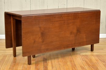 An exceptional deep drop leaf solid