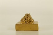 AN EXQUISITE GILT-BRONZE 'DRAG