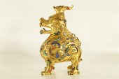 AN EXQUISITE GILT-BRONZE 'UNIC