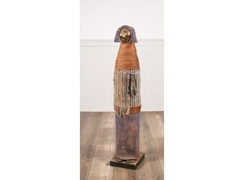 An illegibly signed sculpture of