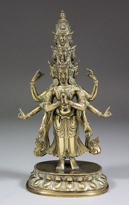 An Indian cast brass standing